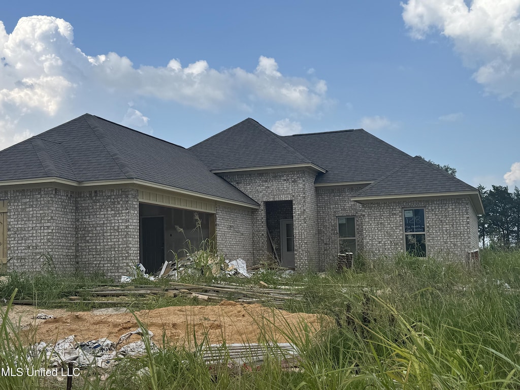 136 Hunters Way, Canton, MS 39046 - french country inspired facade with brick siding and roof with shingles