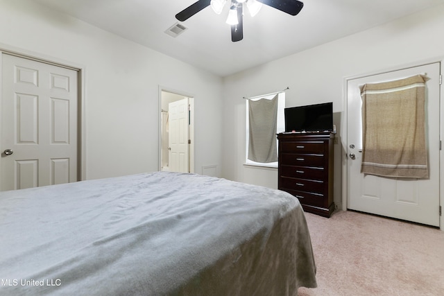 bedroom with light carpet, visible vents, and a ceiling fan