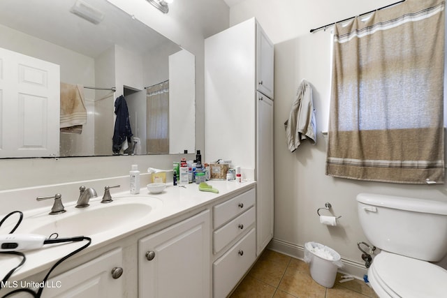 full bathroom with tile patterned flooring, baseboards, vanity, and toilet