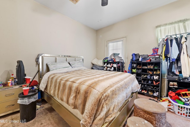 bedroom featuring carpet and a ceiling fan