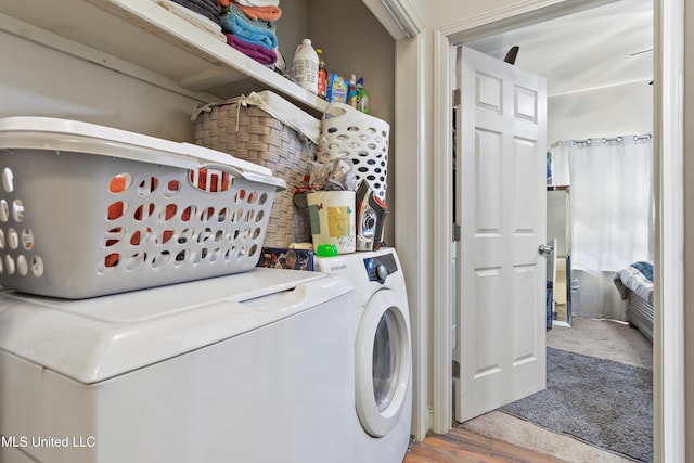 laundry room featuring washer and dryer and laundry area