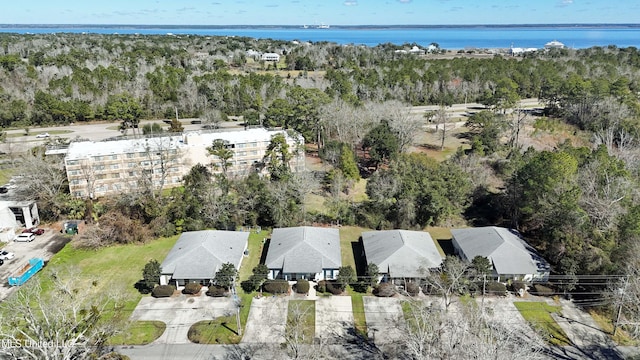 bird's eye view featuring a water view and a view of trees