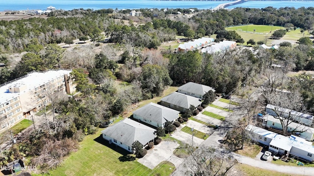 birds eye view of property with a water view and a forest view