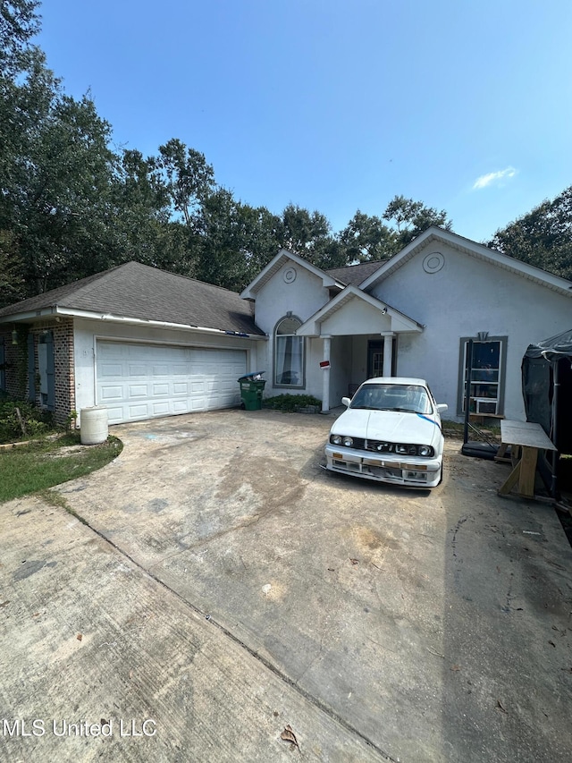 single story home with a garage