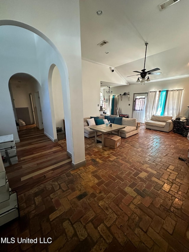 interior space with ceiling fan and high vaulted ceiling