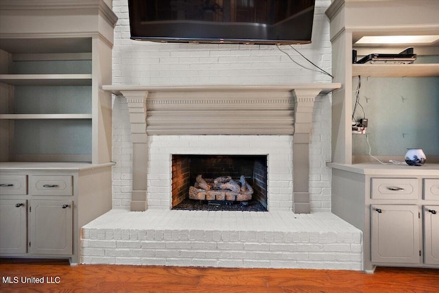512 Dixton Dr, Brandon, MS 39047 - interior details with a brick fireplace and wood finished floors