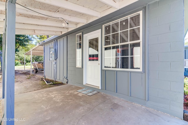 property entrance with a patio area