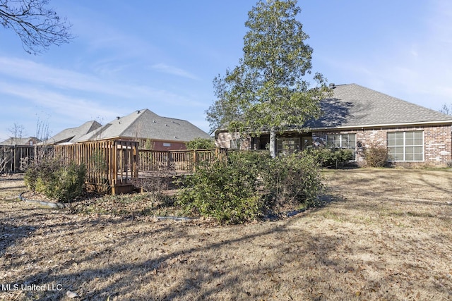 view of yard with a wooden deck