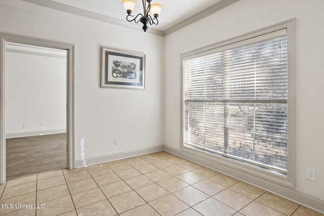 tiled empty room with a notable chandelier, crown molding, and a wealth of natural light