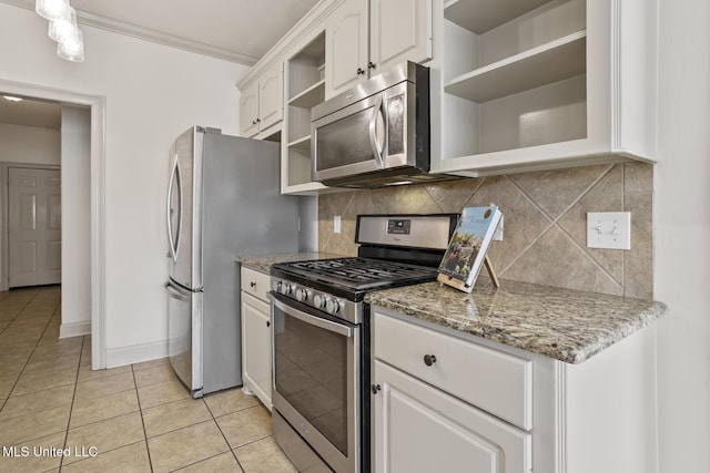 kitchen with light tile patterned flooring, appliances with stainless steel finishes, white cabinets, backsplash, and light stone countertops