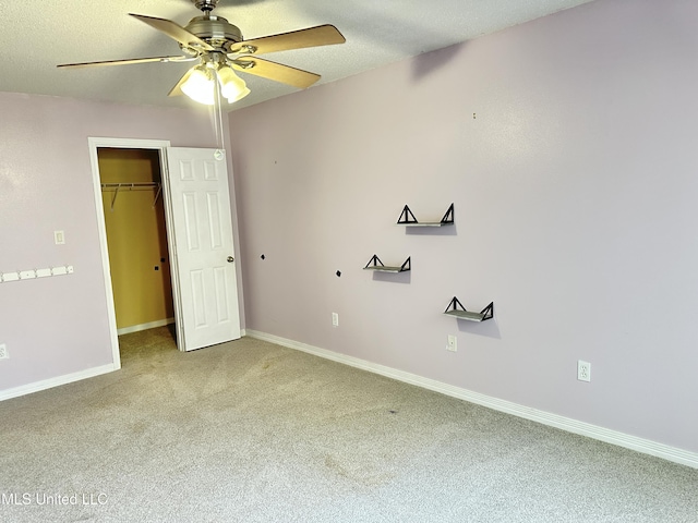 7809 Clamshell Ave, Ocean Springs, MS 39564 - unfurnished bedroom with light carpet, a closet, a textured ceiling, and ceiling fan