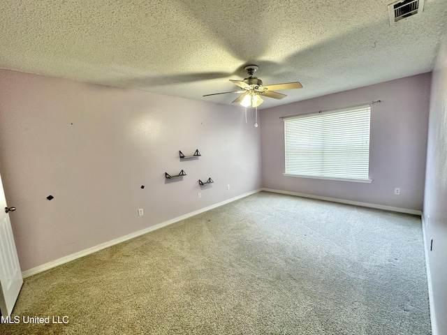 7809 Clamshell Ave, Ocean Springs, MS 39564 - carpeted spare room with a ceiling fan and a textured ceiling
