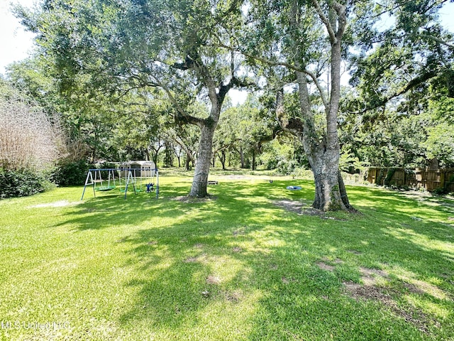 7809 Clamshell Ave, Ocean Springs, MS 39564 - view of yard with a playground and view of scattered trees