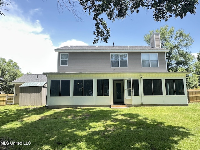 7809 Clamshell Ave, Ocean Springs, MS 39564 - back of property featuring a chimney, a sunroom, entry steps, and a shed