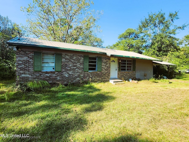 ranch-style house with a front lawn