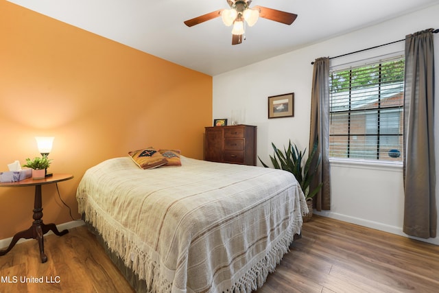 1215 23rd St, Gulfport, MS 39501 - bedroom with wood finished floors and ceiling fan