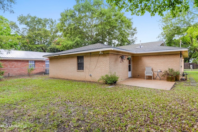 1215 23rd St, Gulfport, MS 39501 - back of property featuring a patio and brick siding
