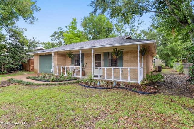 1215 23rd St, Gulfport, MS 39501 - single story home with brick siding, an attached garage, covered porch, and driveway