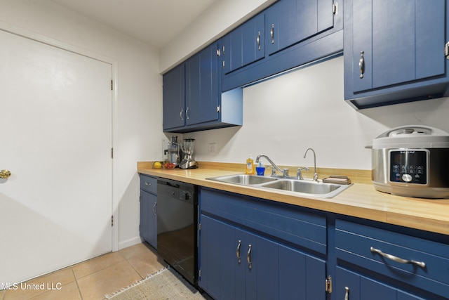 1215 23rd St, Gulfport, MS 39501 - kitchen featuring dishwasher, blue cabinetry, and light tile patterned floors