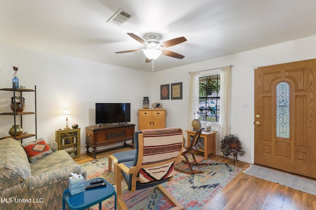 1215 23rd St, Gulfport, MS 39501 - living area with a ceiling fan and wood finished floors