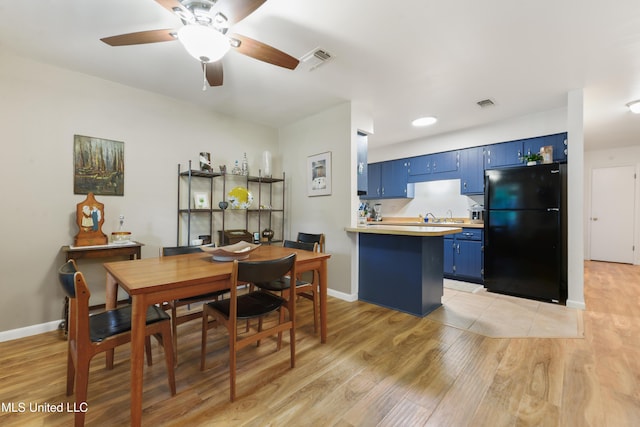 1215 23rd St, Gulfport, MS 39501 - dining space with light wood-style flooring and a ceiling fan