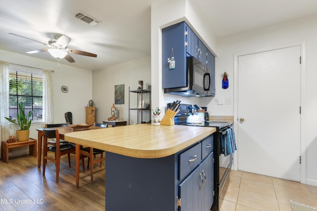 1215 23rd St, Gulfport, MS 39501 - kitchen featuring blue cabinetry, black appliances, a ceiling fan, and light wood finished floors