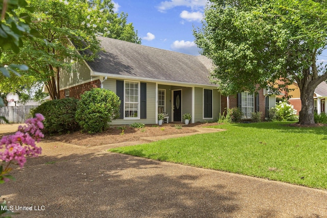 215 Cobblestone Dr, Madison, MS 39110 - single story home with brick siding, a shingled roof, and a front lawn