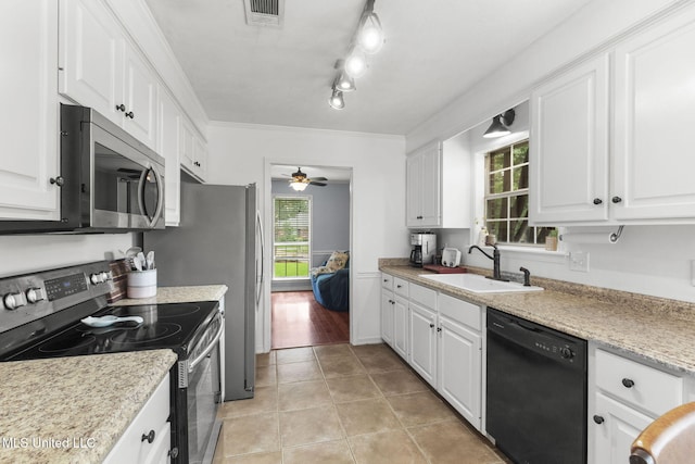 215 Cobblestone Dr, Madison, MS 39110 - kitchen featuring appliances with stainless steel finishes, light tile patterned flooring, white cabinets, ceiling fan, and crown molding