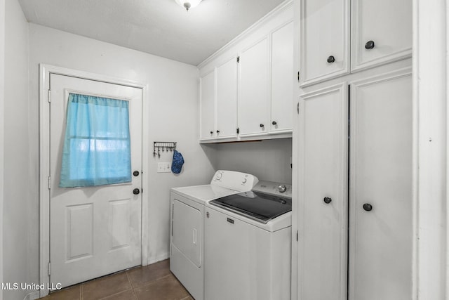 215 Cobblestone Dr, Madison, MS 39110 - laundry room with washer and clothes dryer, cabinet space, and dark tile patterned flooring