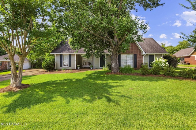 215 Cobblestone Dr, Madison, MS 39110 - view of front of home with a front lawn, a garage, and a shingled roof