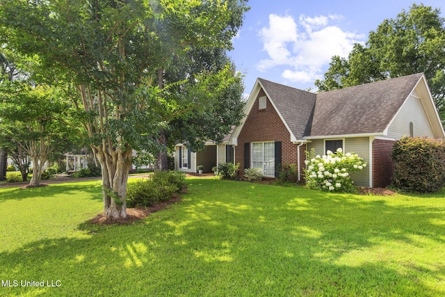215 Cobblestone Dr, Madison, MS 39110 - view of front of property with brick siding, roof with shingles, and a front yard