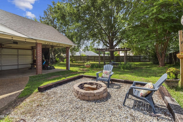 215 Cobblestone Dr, Madison, MS 39110 - fenced backyard with a fire pit and a patio
