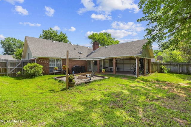 215 Cobblestone Dr, Madison, MS 39110 - rear view of house featuring a patio area, a garage, brick siding, a chimney, and a fenced backyard