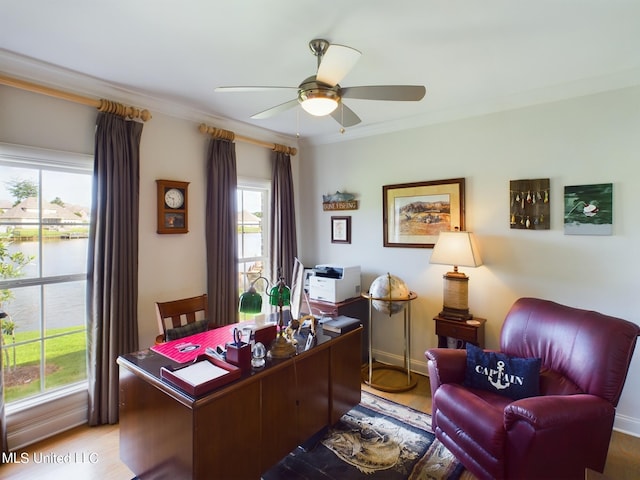 office featuring crown molding, light hardwood / wood-style flooring, a water view, and ceiling fan