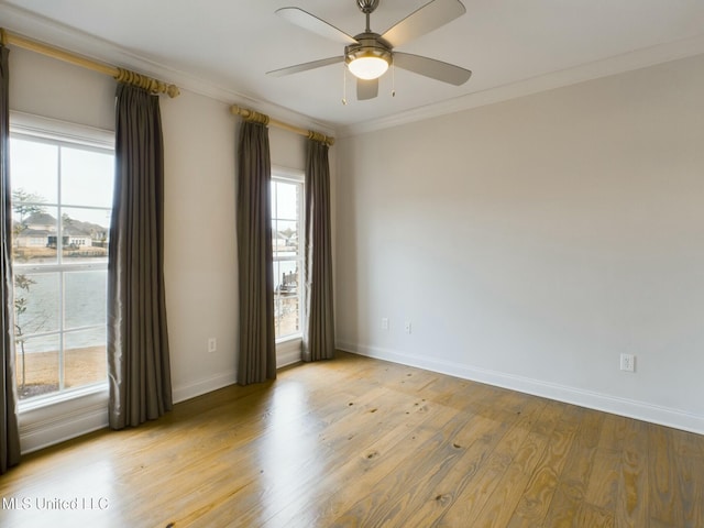 unfurnished room with light wood-type flooring, plenty of natural light, crown molding, and ceiling fan