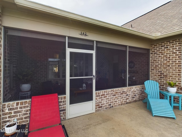 exterior space featuring a sunroom