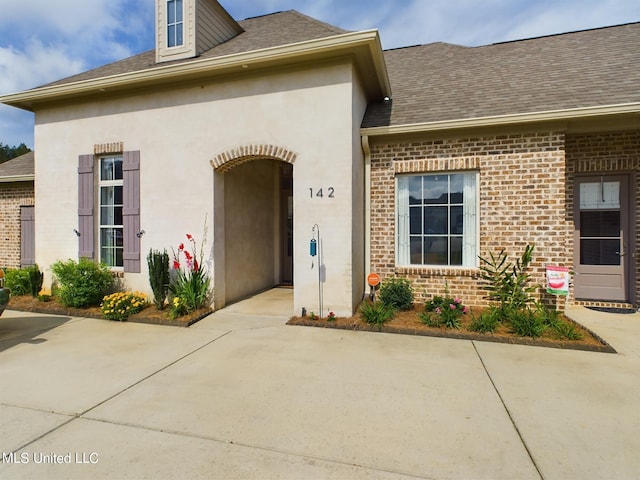 property entrance with a patio area