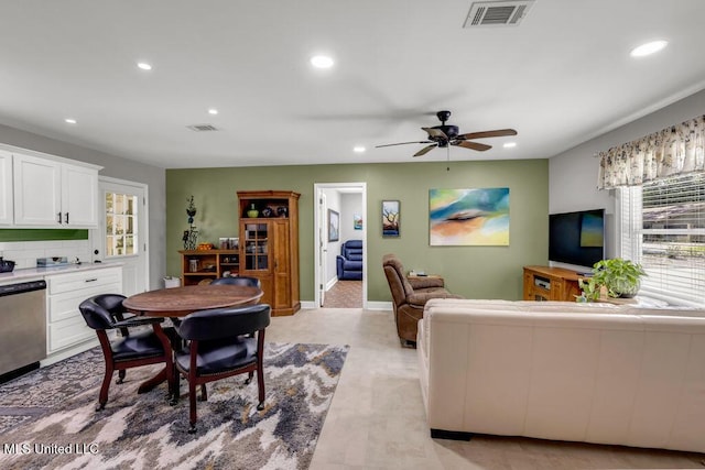 2085 Pat Ln, Biloxi, MS 39531 - living room featuring recessed lighting, ceiling fan, baseboards, bar, and light wood-style floors
