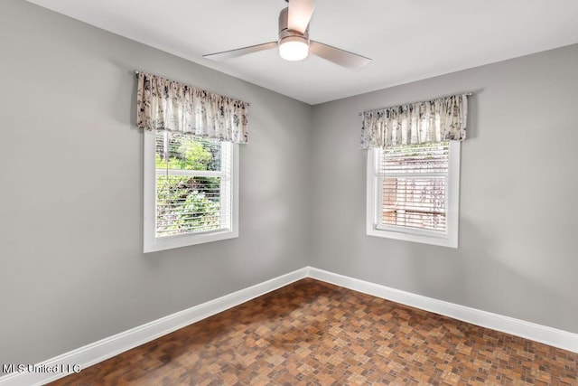 2085 Pat Ln, Biloxi, MS 39531 - unfurnished room featuring baseboards and ceiling fan