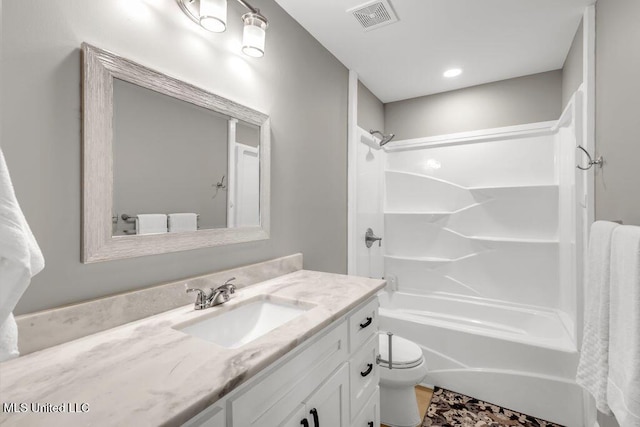 2085 Pat Ln, Biloxi, MS 39531 - bathroom featuring vanity, washtub / shower combination, and toilet