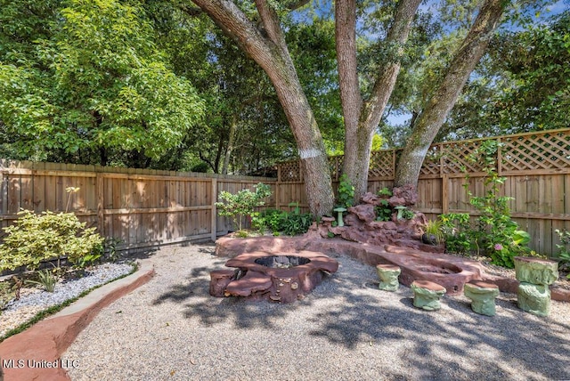 2085 Pat Ln, Biloxi, MS 39531 - fenced backyard with a fire pit