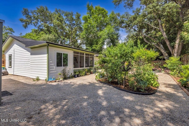 2085 Pat Ln, Biloxi, MS 39531 - view of side of home with a sunroom
