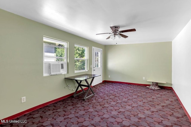2085 Pat Ln, Biloxi, MS 39531 - unfurnished room with baseboards, a ceiling fan, and dark carpet