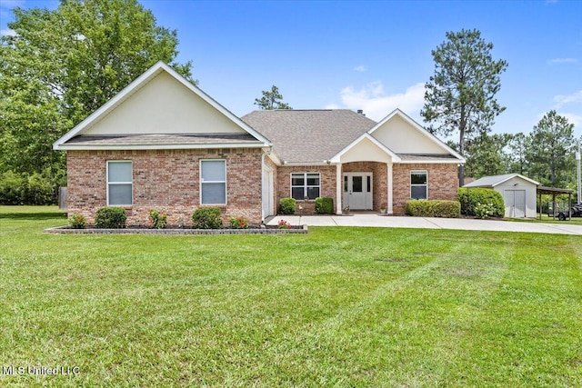 21915 Huntington Forest Dr, Saucier, MS 39574 - view of front of house featuring a front yard, brick siding, and a shingled roof