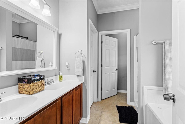 21915 Huntington Forest Dr, Saucier, MS 39574 - full bath with ornamental molding, double vanity, tile patterned floors, a bathtub, and baseboards