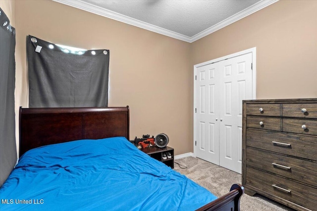21915 Huntington Forest Dr, Saucier, MS 39574 - bedroom featuring carpet floors, ornamental molding, a closet, a textured ceiling, and baseboards