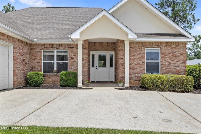 21915 Huntington Forest Dr, Saucier, MS 39574 - property entrance with brick siding and roof with shingles