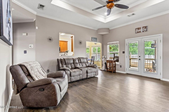 21915 Huntington Forest Dr, Saucier, MS 39574 - living area with ceiling fan, dark wood-style floors, french doors, crown molding, and a tray ceiling