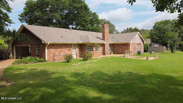 ranch-style house with a chimney, a garage, brick siding, fence, and a front lawn