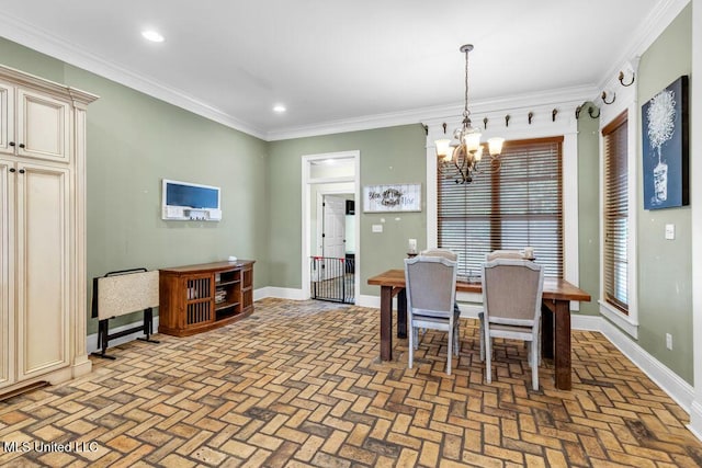 769 Mclane Ln, Biloxi, MS 39532 - dining room with brick patterned flooring, a chandelier, crown molding, and recessed lighting